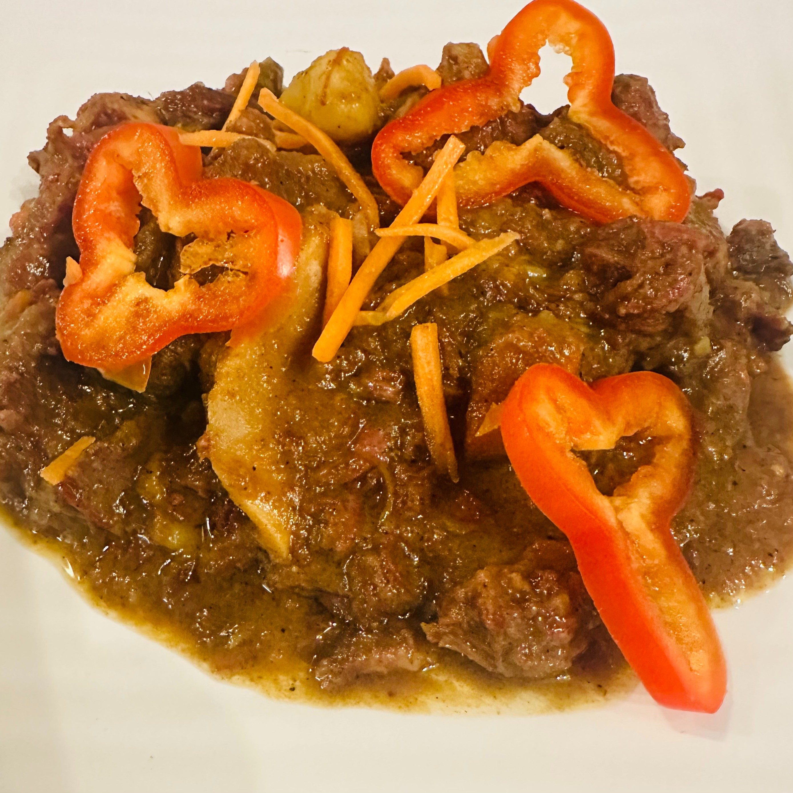 Extra Portion Curried Goat*.